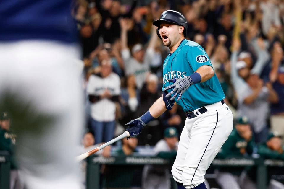 Seattle Mariners catcher Cal Raleigh reacts after hitting a walk-off home run against the Oakland A's that clinched the franchise's first playoff berth since 2001.