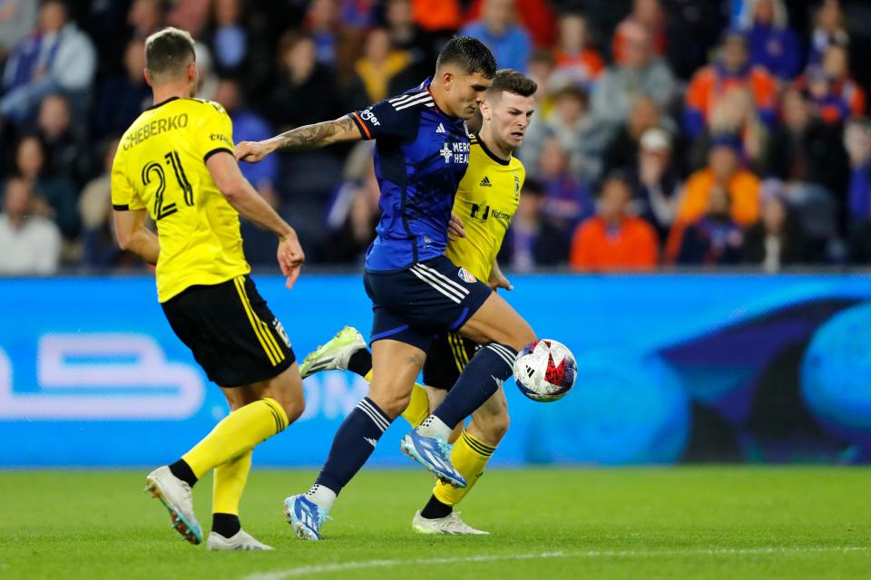 Dec 2, 2023; Cincinnati, Ohio, USA; FC Cincinnati forward Brandon Vazquez (19) makes a play for the ball against Crew defender Yevhen Cheberko (21) and midfielder Sean Zawadzki (25) during the first half at TQL Stadium. Mandatory Credit: Katie Stratman-USA TODAY Sports