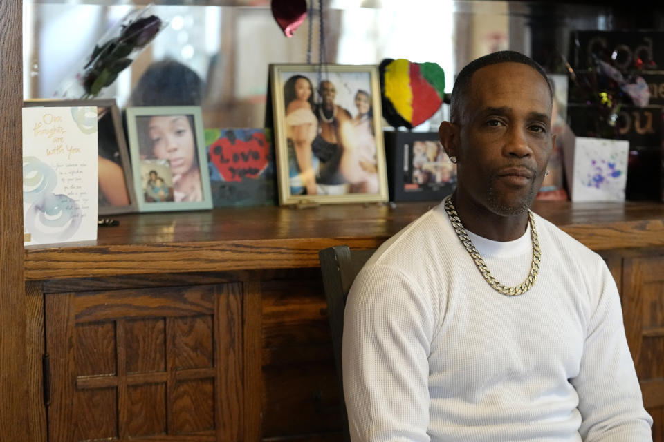 Damone Presley sits next to a memorial area in his house for his daughter, Nitosha, Thursday, May 4, 2023, in St. Paul, Minn. Nitosha and her three friends were found shot to death inside an SUV in the middle of a Wisconsin cornfield, though they were killed in St. Paul, Minnesota. (AP Photo/Abbie Parr)