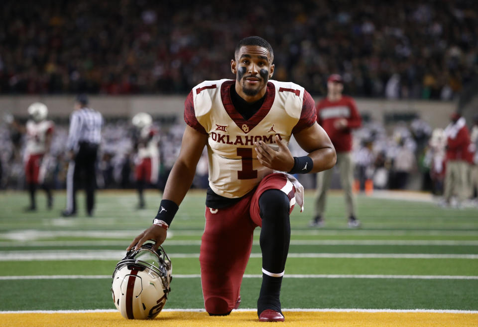 WACO, TEXAS - NOVEMBER 16:   Jalen Hurts #1 of the Oklahoma Sooners kneels in the endzone before a game against the Baylor Bears at McLane Stadium on November 16, 2019 in Waco, Texas. (Photo by Ronald Martinez/Getty Images)