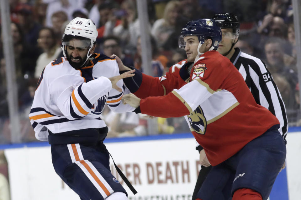 Edmonton Oilers left wing Jujhar Khaira (16) and Florida Panthers defenseman Josh Brown (2) fight during the second period of an NHL hockey game, Saturday, Feb. 15, 2020, in Sunrise, Fla. (AP Photo/Lynne Sladky)