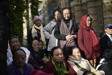 Family of retired Gurkha soldiers stand in protest during a demonstration outside the Palace of Westminster in London October 25, 2013. REUTERS/Dylan Martinez