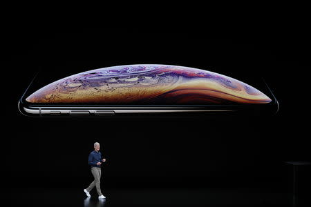 Tim Cook, CEO of Apple, speaks about the iPhone XS and XS Max at an Apple Inc product launch event at the Steve Jobs Theater in Cupertino, California, U.S., September 12, 2018. REUTERS/Stephen Lam