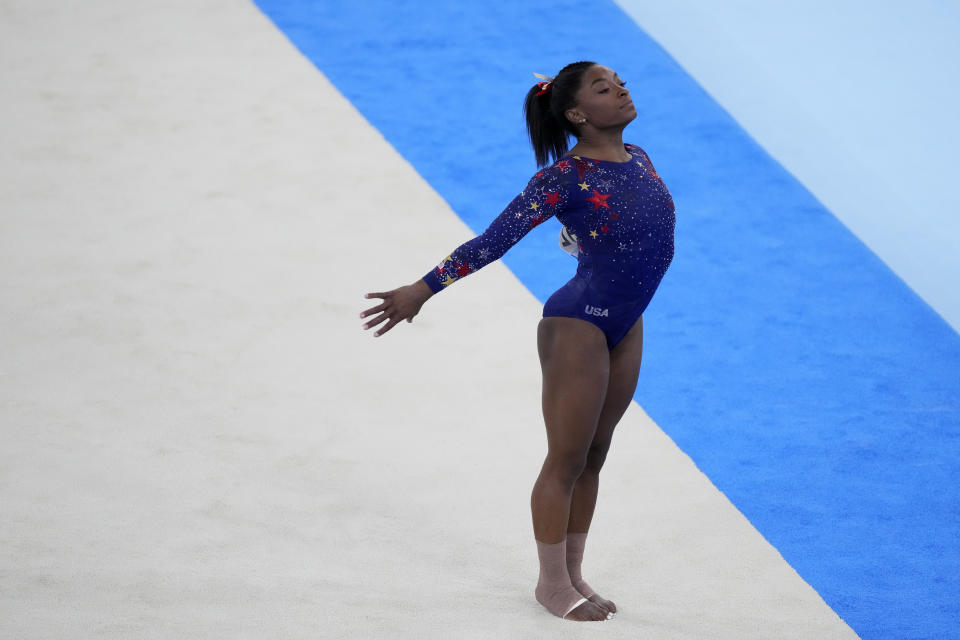 Simone Biles, of United States, performs her floor exercise routine during the women's artistic gymnastic qualifications at the 2020 Summer Olympics, Sunday, July 25, 2021, in Tokyo. (AP Photo/Ashley Landis)