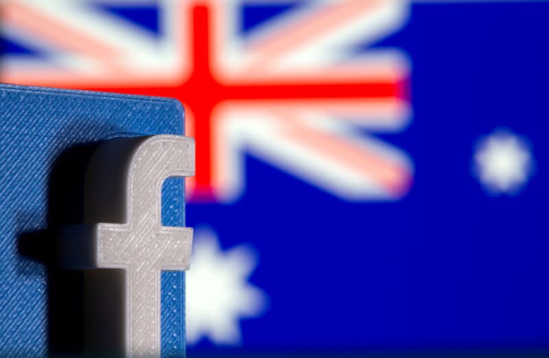 FILE PHOTO: A 3D printed Facebook logo is seen in front of displayed Australia's flag in this illustration photo