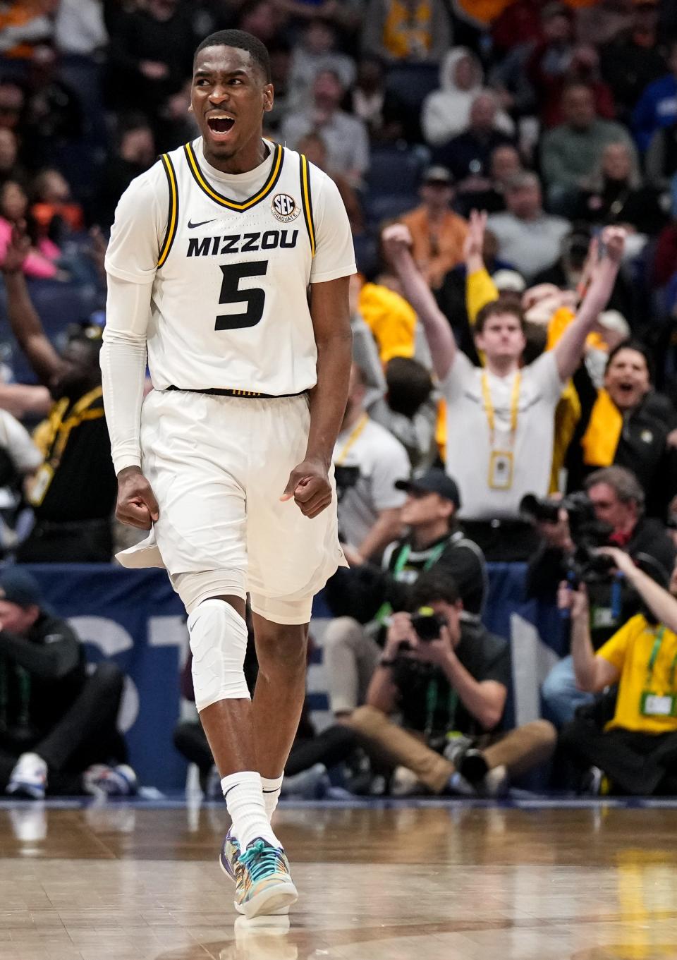 Missouri guard D'Moi Hodge (5) celebrates his three-point basket against Tennessee during the second half of a SEC Men’s Basketball Tournament quarterfinal game at Bridgestone Arena in Nashville, Tenn., Friday, March 10, 2023.