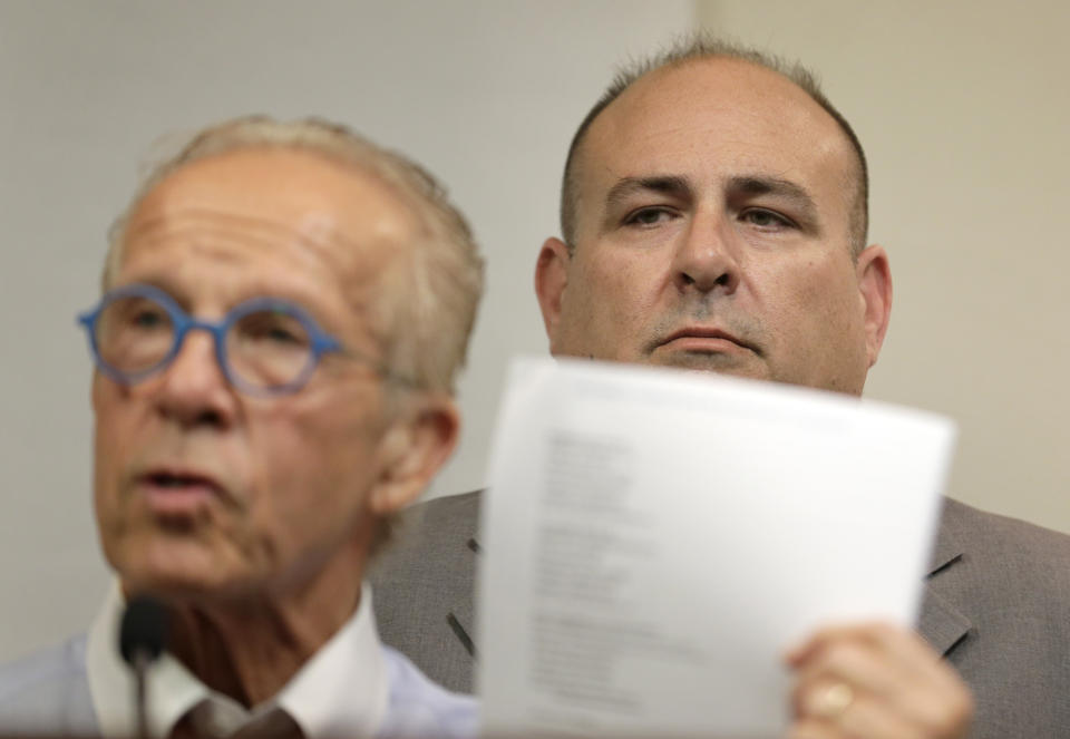 While Richard Halvorson, right, listens, attorney Jeff Anderson speaks during a news conference in Newark, N.J., Tuesday, April 30, 2019. Halvorson is alleging sexual abuse in a lawsuit filed against the Boy Scouts of America. (AP Photo/Seth Wenig)