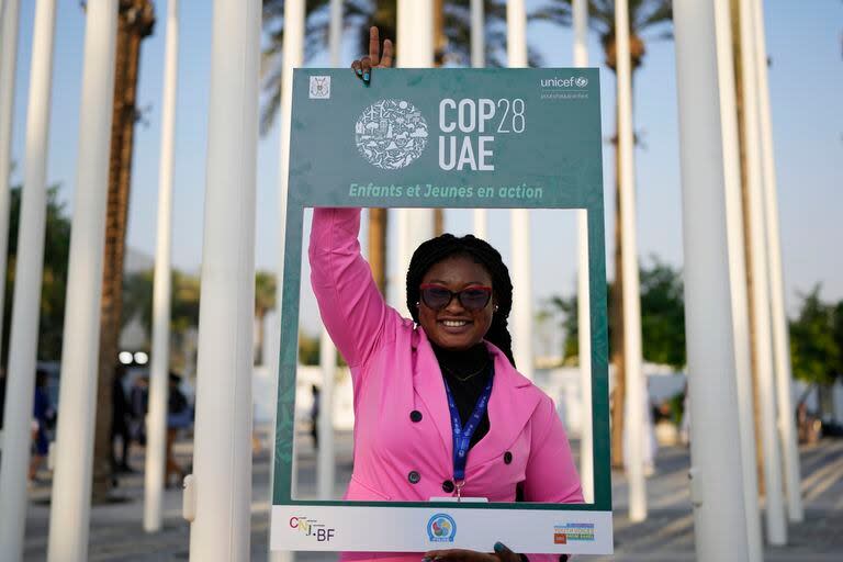 Margueritte Sanou poses for a photo at the COP28 U.N. Climate Summit, Saturday, Dec. 2, 2023, in Dubai, United Arab Emirates. (AP Photo/Rafiq Maqbool)