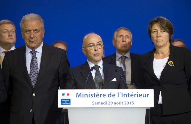 French Interior Minister Bernard Cazeneuve (C), delivers a speech during a press conference in Paris on August 29, 2015