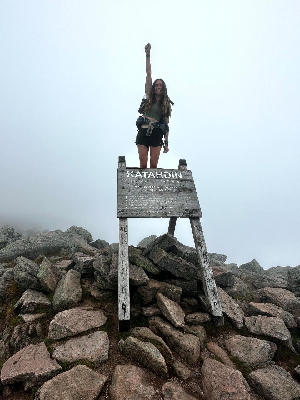 Alexis Holzmann poses triumphantly at the summit of Mount Katahdin in Maine, the end point of the 2,200-mile Appalachian Trail. The Poughkeepsie native spent six months hiking the famous course, completing it on Aug. 30, 2023.