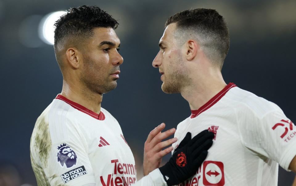 Casemiro with Diogo Dalot on a night both will want to forget fast
