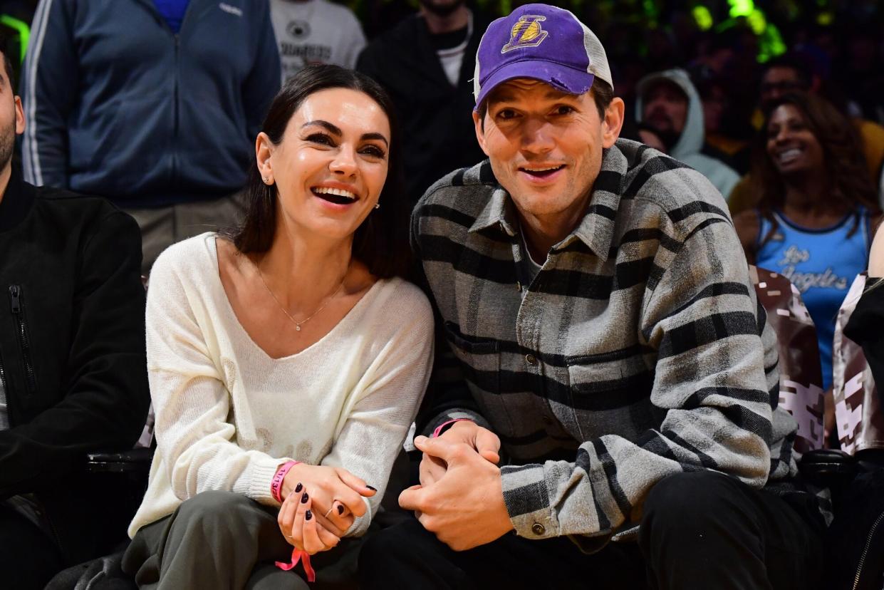 Mila Kunis and Ashton Kutcher attend the game between the Brooklyn Nets and the Los Angeles Lakers on November 13, 2022 at Crypto.Com Arena in Los Angeles, California.