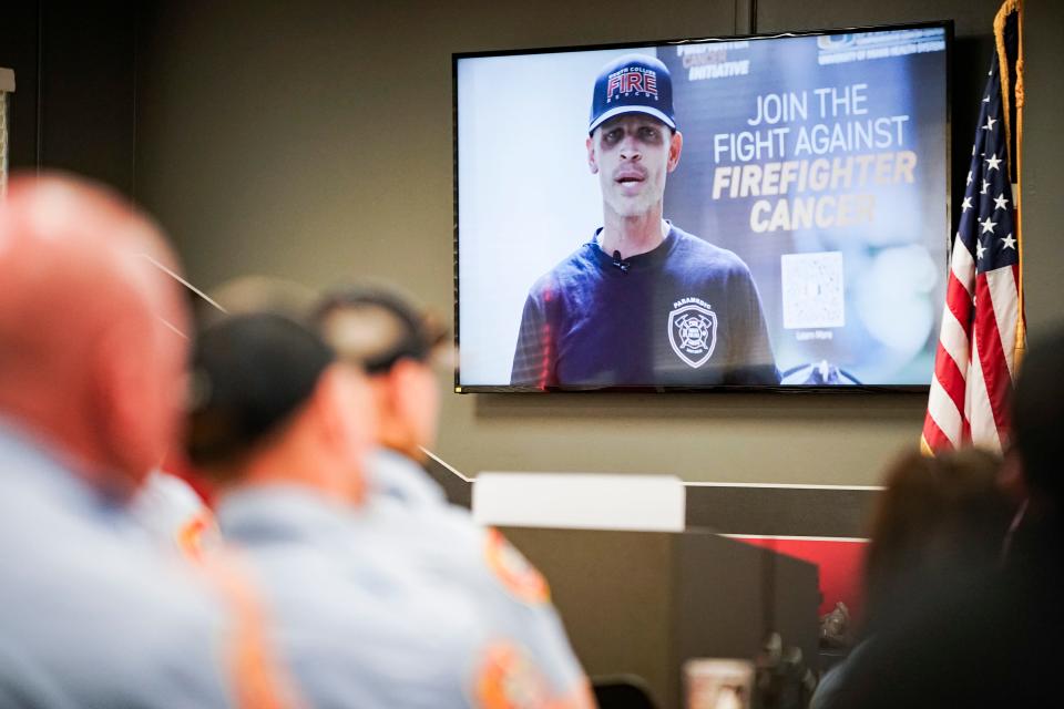 First responders listen to a video from David Perez, a North Collier firefighter diagnosed with cancer in 2019, during a cancer prevention class hosted by the University of Miami’s Sylvester Comprehensive Cancer Center at North Collier Fire and Rescue Station 45 in Naples on Wednesday, June 14, 2023.