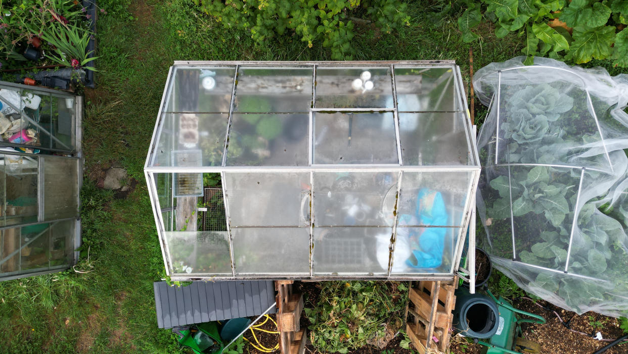 Overhead aerial view of a greenhouse in a garden