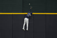 Tampa Bay Rays center fielder Kevin Kiermaier can't get a glove on a home run by Los Angeles Dodgers' Justin Turner during the first inning in Game 4 of the baseball World Series Saturday, Oct. 24, 2020, in Arlington, Texas. (AP Photo/Tony Gutierrez)