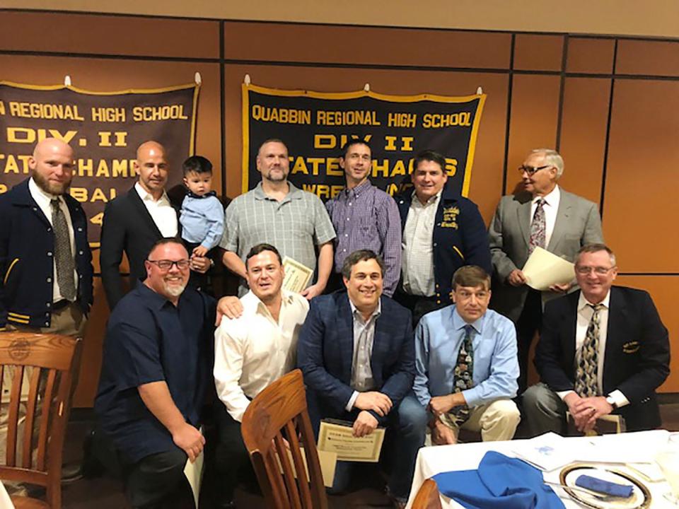 The 2003-04 Quabbin Regional wresting team will join the 1986-87 state championship wrestling team, pictured, in the school's athletic hall of fame when the hall's ninth class of inductees is enshrined on Nov. 12, 2022.