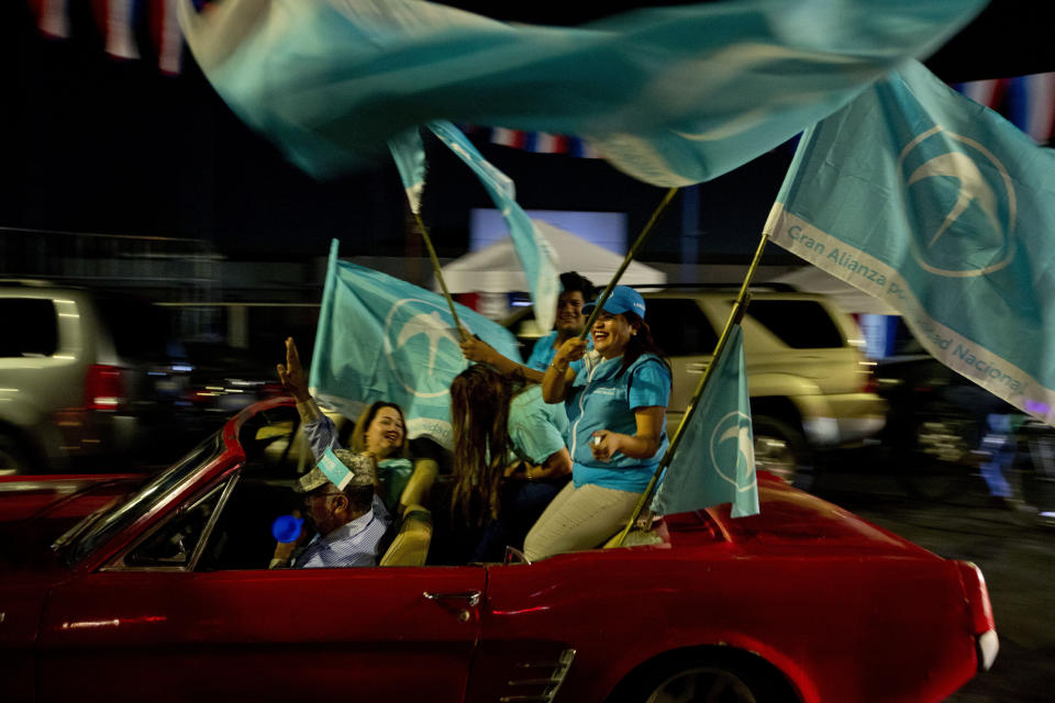 Supporters of presidential frontrunner Nayib Bukele, of the Grand National Alliance for Unity, GANA, take part in a rally in San Salvador, El Salvador, Wednesday, Jan. 30, 2019. Salvadorans go to the polls to elect a new president on Sunday. (AP Photo/Moises Castillo)