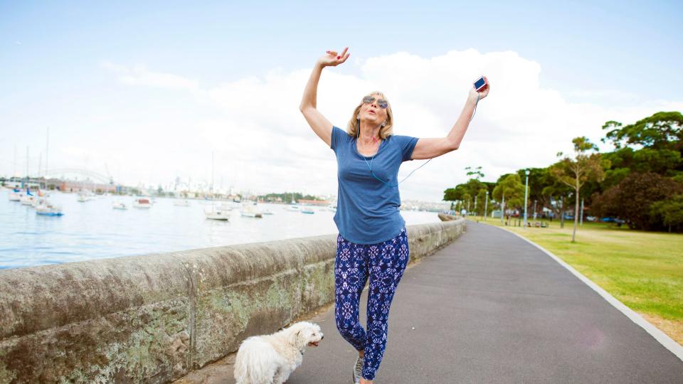 Woman dancing with her dog