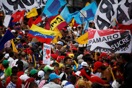 Supporters of Venezuela's President Nicolas Maduro attend his closing campaign rally in Caracas, Venezuela, May 17, 2018. REUTERS/Carlos Garcia Rawlins