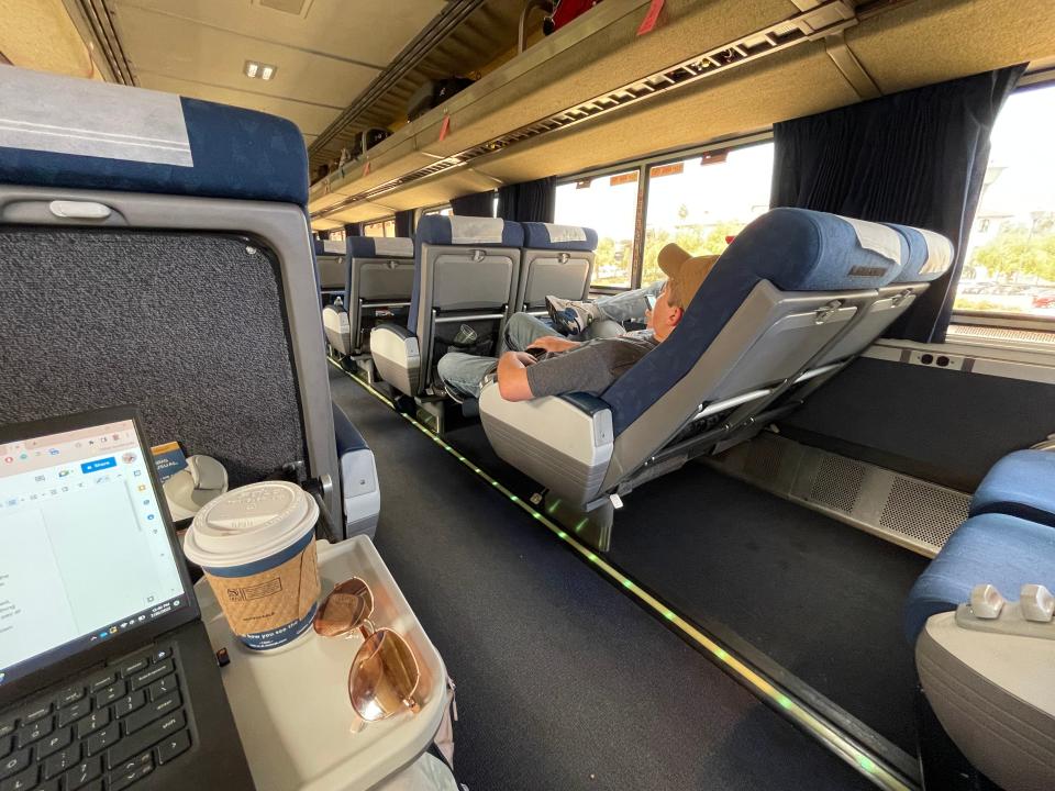 The inside of an Amtrak coast starlight with seats reclined