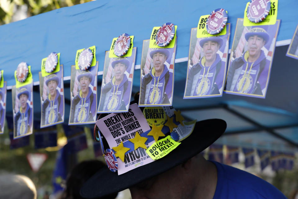 A stall sells Brexit paraphernalia near the Houses of Parliament in London, Saturday, Oct. 19, 2019. Britain's Parliament is set to vote in a rare Saturday sitting on Prime Minister Boris Johnson's new deal with the European Union, a decisive moment in the prolonged bid to end the Brexit stalemate. Various scenarios may be put in motion by the vote. (AP Photo/Kirsty Wigglesworth)