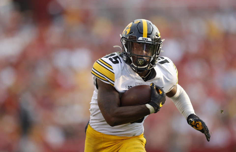 Iowa running back Tyler Goodson (15) runs the ball during the second half of an NCAA college football game against Iowa State, Saturday, Sept. 11, 2021, in Ames, Iowa. Iowa won 27-17. (AP Photo/Matthew Putney)