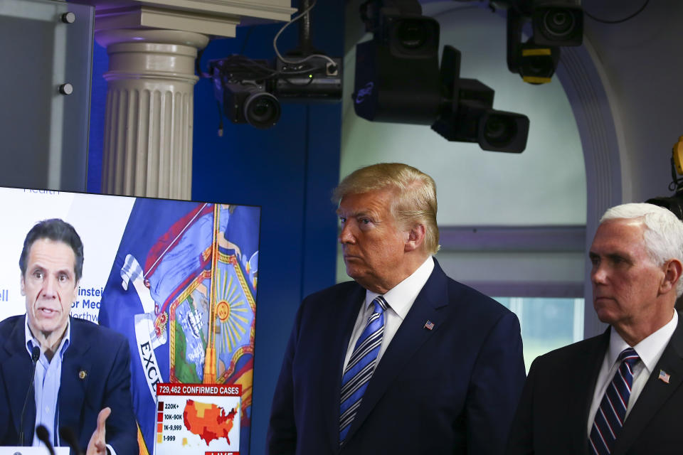 President Donald Trump, with Vice President Mike Pence, watches a clip of New York Gov. Andrew Cuomo at the daily coronavirus briefing. Trump's Department of Justice was accused of politicizing the pandemic when it targeted nursing home data in four states with Democratic governors, including New York. (Photo: Tasos Katopodis/Getty Images)