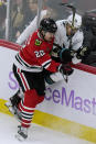 San Jose Sharks defenseman Radim Simek, right, is checked by Chicago Blackhawks center Ryan Carpenter during the second period of an NHL hockey game in Chicago, Sunday, Nov. 28, 2021. (AP Photo/Nam Y. Huh)
