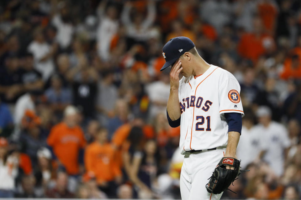 Houston Astros starting pitcher Zack Greinke reacts after giving up a home run to New York Yankees' Giancarlo Stanton during the sixth inning in Game 1 of baseball's American League Championship Series Saturday, Oct. 12, 2019, in Houston. (AP Photo/Matt Slocum)