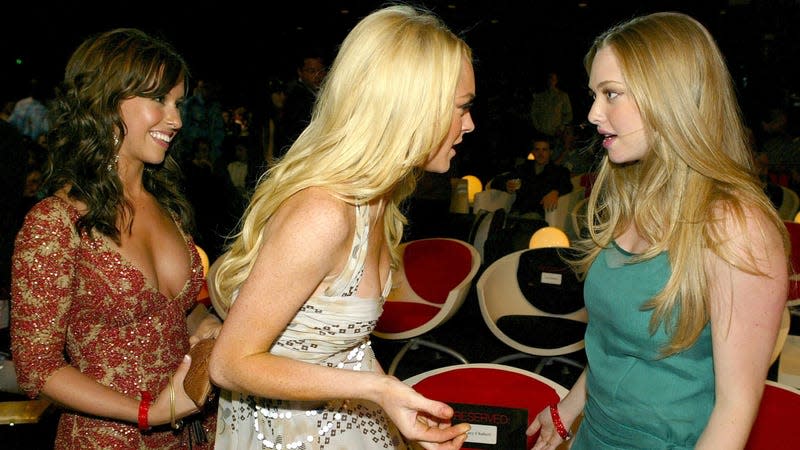 Lacey Chabert and Lindsay Lohan presumably telling Amanda Seyfried not to talk about Mean Girls 2