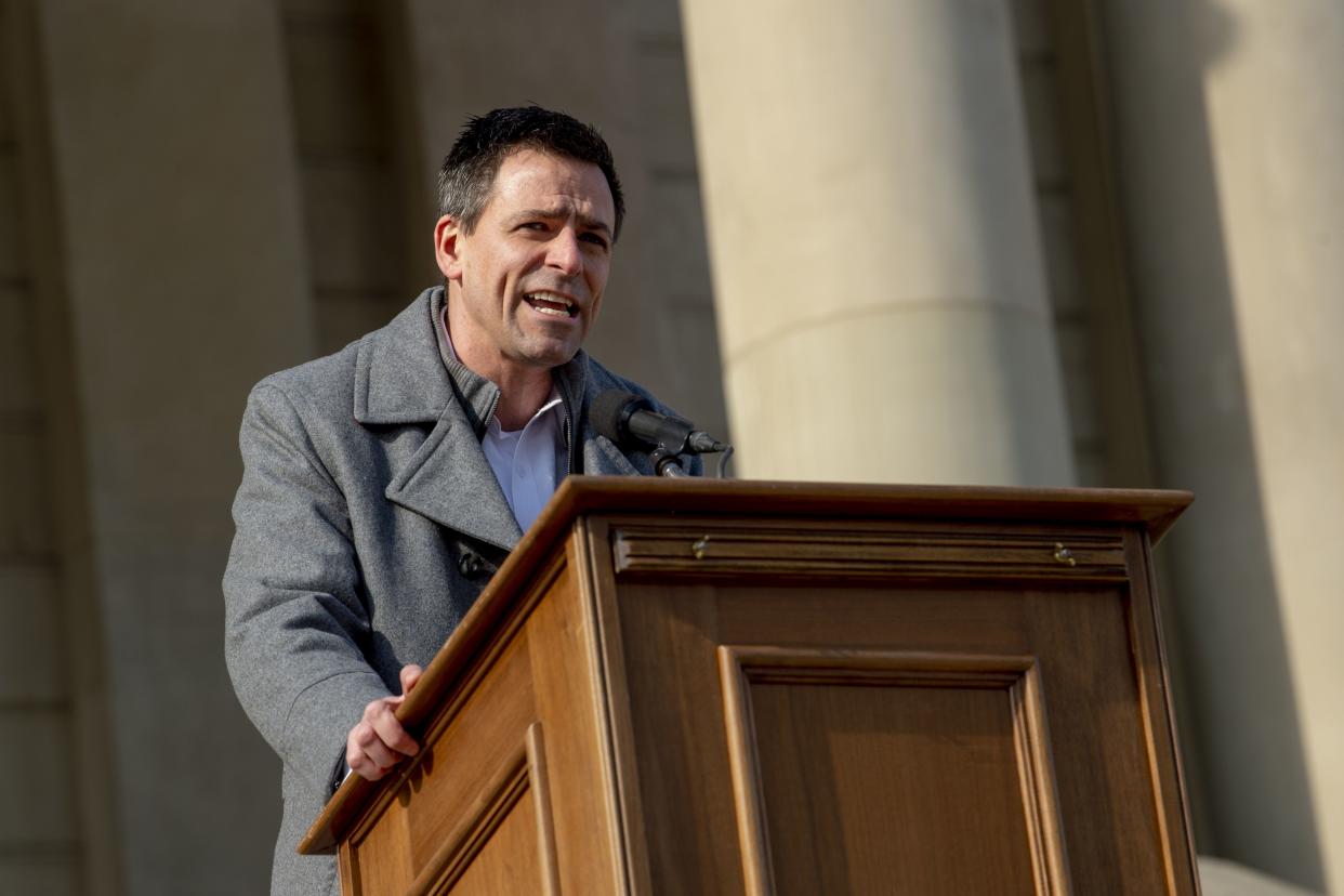 Ryan Kelley, a Republican gubernatorial candidate, speaks to conservative activists that are demanding another investigation into former President Donald Trump's loss during a rally on Feb. 8, 2022 outside the Michigan Capitol in Lansing, Mich.