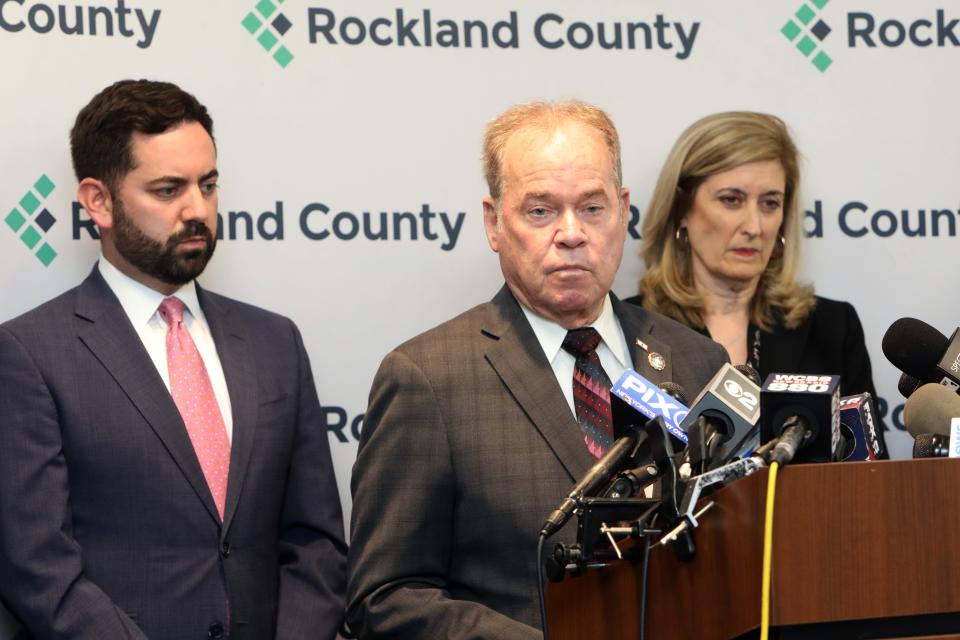 County Executive Ed Day, flanked by Congressman Mike Lawler and Orangetown Supervisor Teresa Kenny, stands against 300 asylum seekers at a Rockland hotel to help manage the huge influx of asylum seekers bused in to New York City from the southern border, May 8, 2023 in New York.