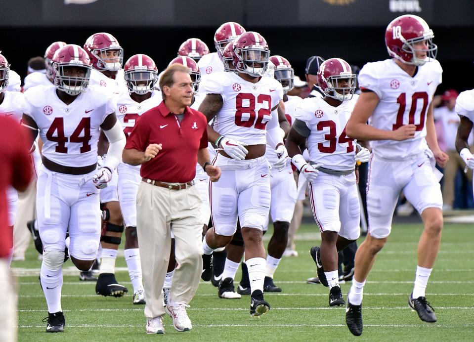 NASHVILLE, TN – SEPTEMBER 23: Head coach Nick Saban of the Alabama Crimson Tide runs onto the field with his team prior to a game against the Vanderbilt Commodores during the first half at Vanderbilt Stadium on September 23, 2017 in Nashville, Tennessee. (Photo by Frederick Breedon/Getty Images)