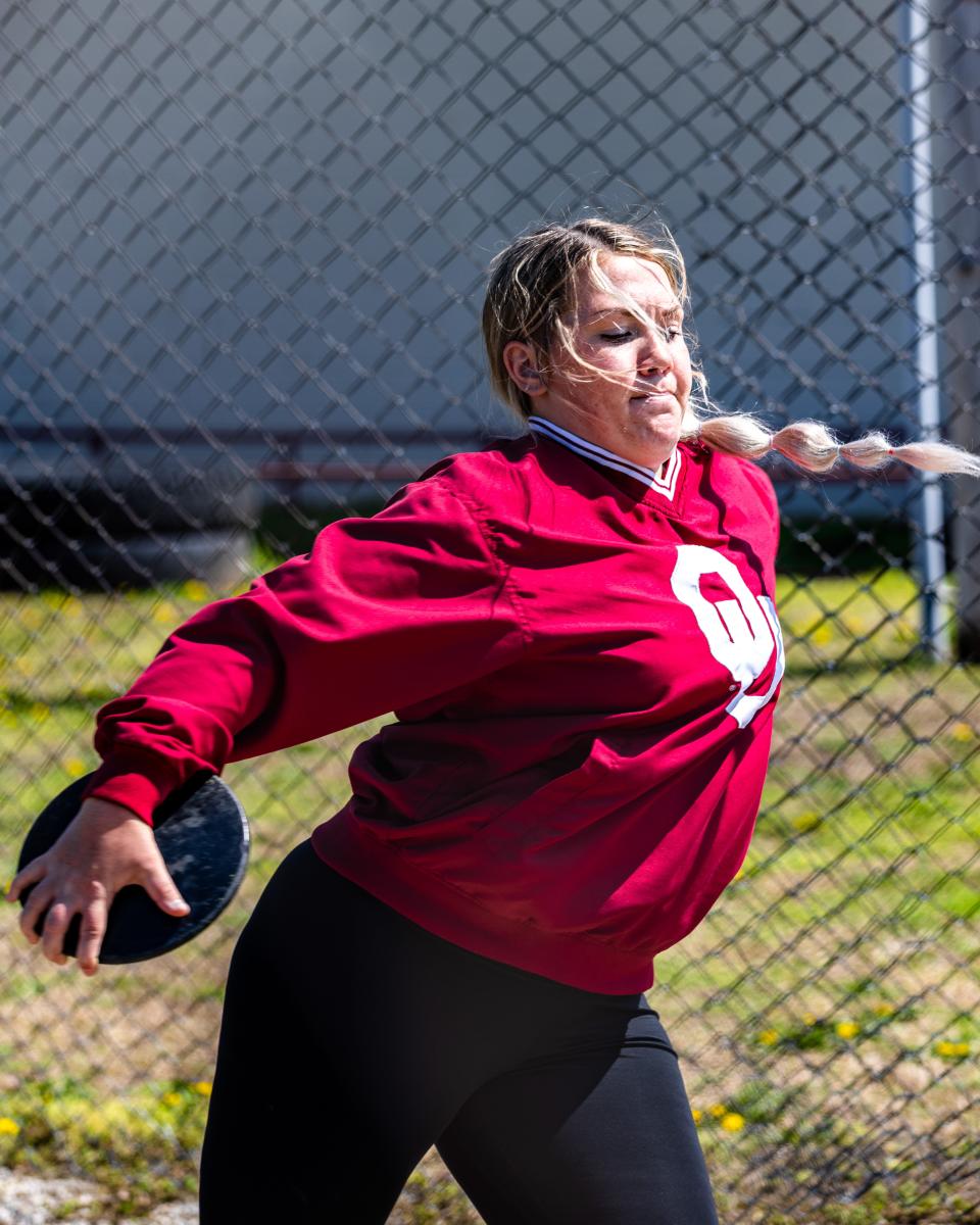 Dewey's Katie Wright practices discus during her junior season.