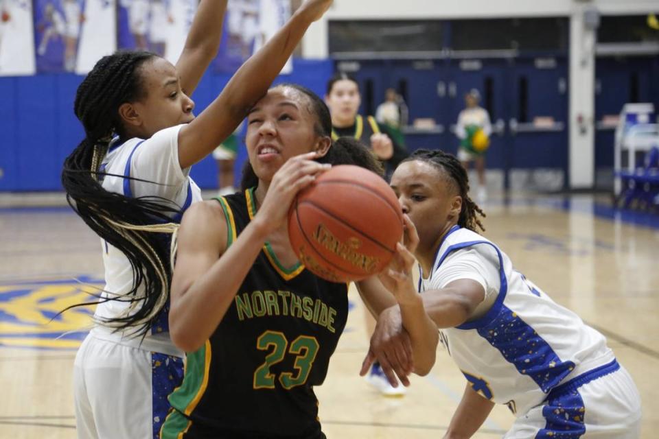 Bryan Station’s Kailyn Gentry is double-teamed in the post by Henry Clay’s Tamia Waide and Timarri Miller during their game on Friday. Jared Peck/jpeck@herald-leader.com