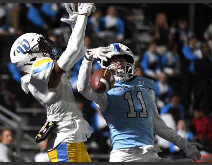 Bartlesville High School's Jett Scully, right, breaks up a pass in the end zone during a 31-28 win on Oct. 6, 2023, vs. Putnam City West. Scully also scored a rushing touchdown.