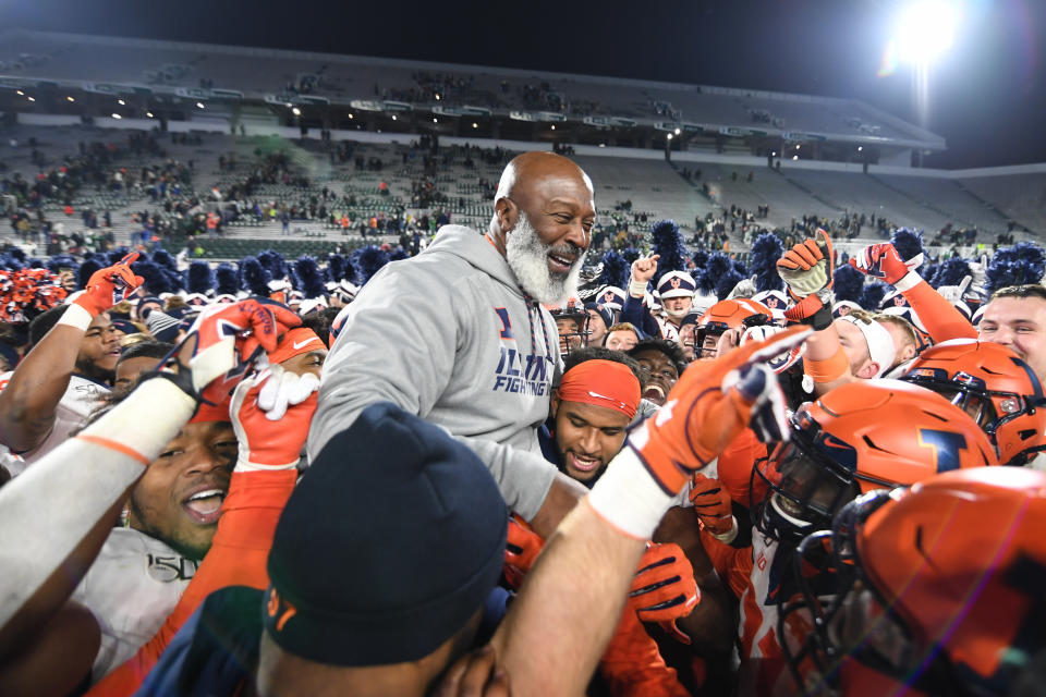 EAST LANSING, MI - NOVEMBER 09: Members of Illinois football team pick coach Lovie Smith up on their shoulders following a college football game between the Michigan State Spartans and Illinois Fighting Illini on November 9, 2019 at Spartan Stadium in East Lansing, MI. (Photo by Adam Ruff/Icon Sportswire via Getty Images)