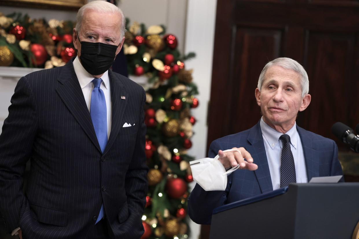 Anthony Fauci (R), Director of the National Institute of Allergy and Infectious Diseases and Chief Medical Advisor to the President, speaks alongside U.S. President Joe Biden as he delivers remarks on the Omicron COVID-19 variant following a meeting of the COVID-19 response team at the White House on Nov. 29, 2021, in Washington, DC. The World Health Organization designated it a variant of concern after South African officials discovered the variant last week.
