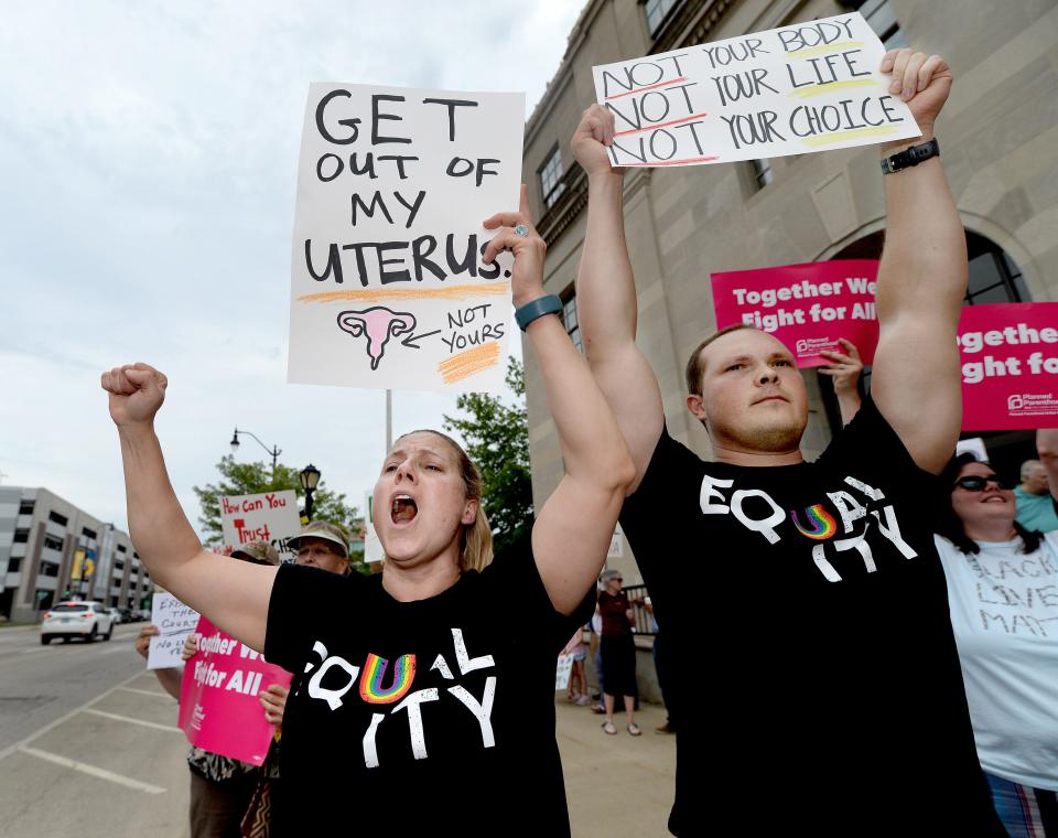 Angela Neubeck, left, and her husband Hermann Neubeck, both of Springfield, attend a protest rally in front of the federal courthouse in Springfield following the U.S. Supreme Court decision to overturn Roe v. Wade Friday June 24, 2022.