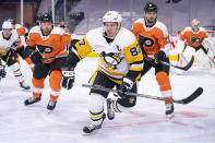 Pittsburgh Penguins' Sidney Crosby, center, heads after the puck after winning the face off against Philadelphia Flyers' Scott Laughton, right, with Michael Raffl, left, following during the third period of an NHL hockey game, Wednesday, Jan. 13, 2021, in Philadelphia. The Flyers won 6-3. (AP Photo/Chris Szagola)