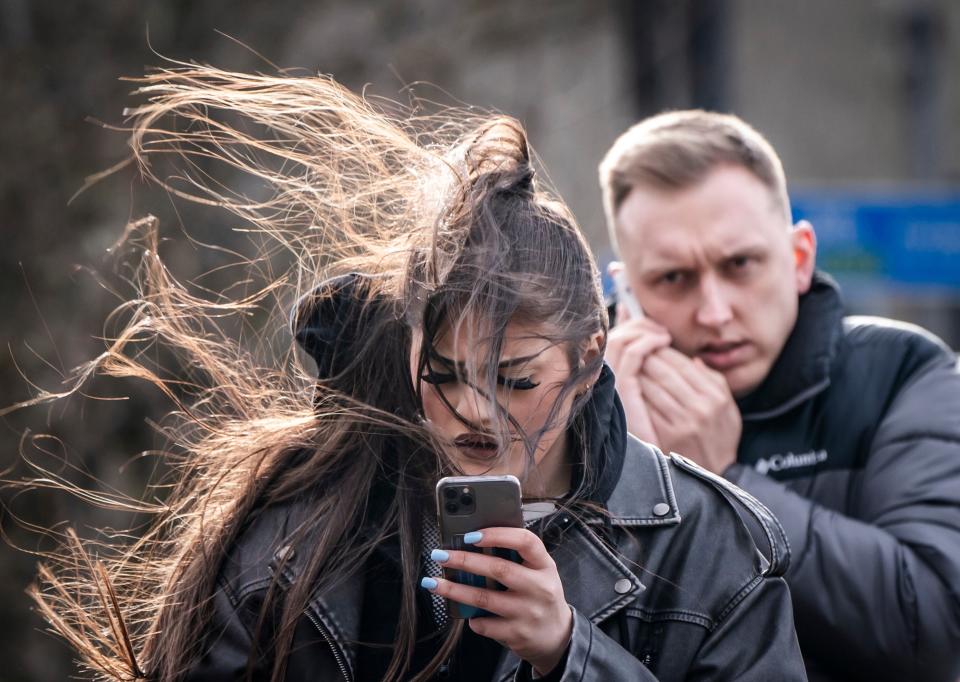 A woman in windy conditions in Leeds. Storm Jocelyn has brought fresh travel disruption to much of the UK (PA)