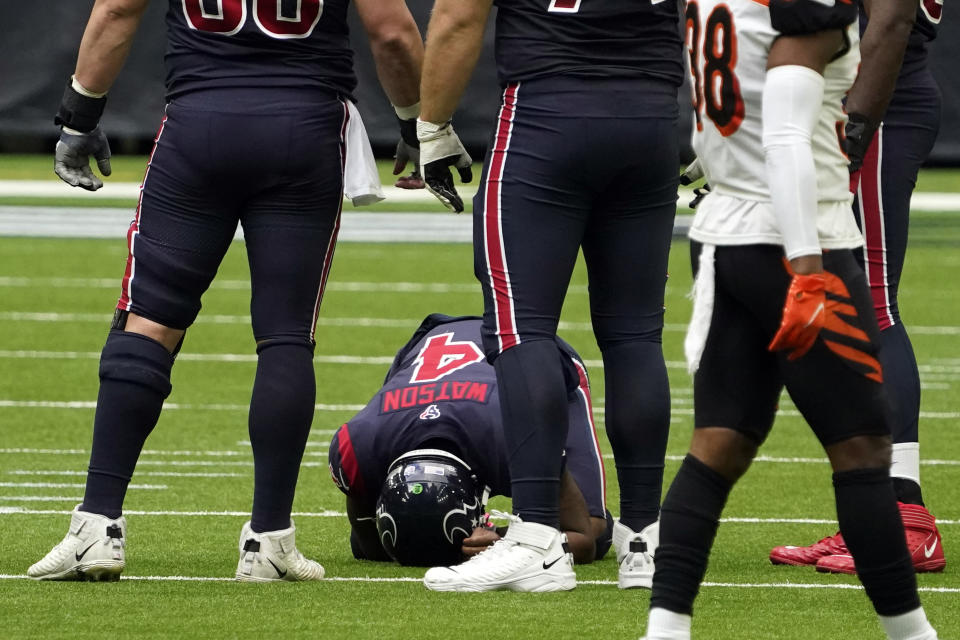 Deshaun Watson fumbled late on Sunday after his hand got stuck in a Bengals player's helmet mid-throw. (AP/Sam Craft)