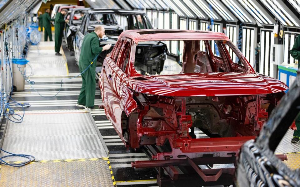 Range Rover sports utility vehicles (SUV) in the paintshop at Tata Motors Ltd.'s Jaguar Land Rover vehicle manufacturing plant in Solihull, UK - Chris Ratcliffe/Bloomberg