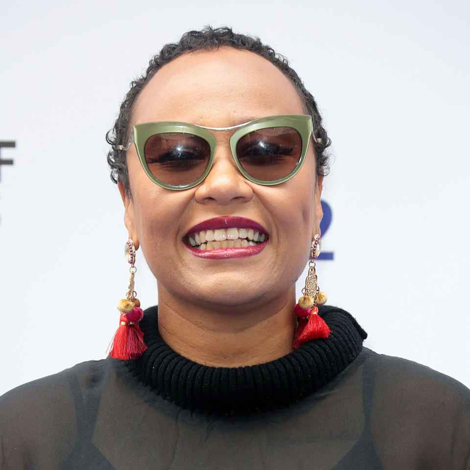 Emeli Sande facing camera smiling with sunglasses on