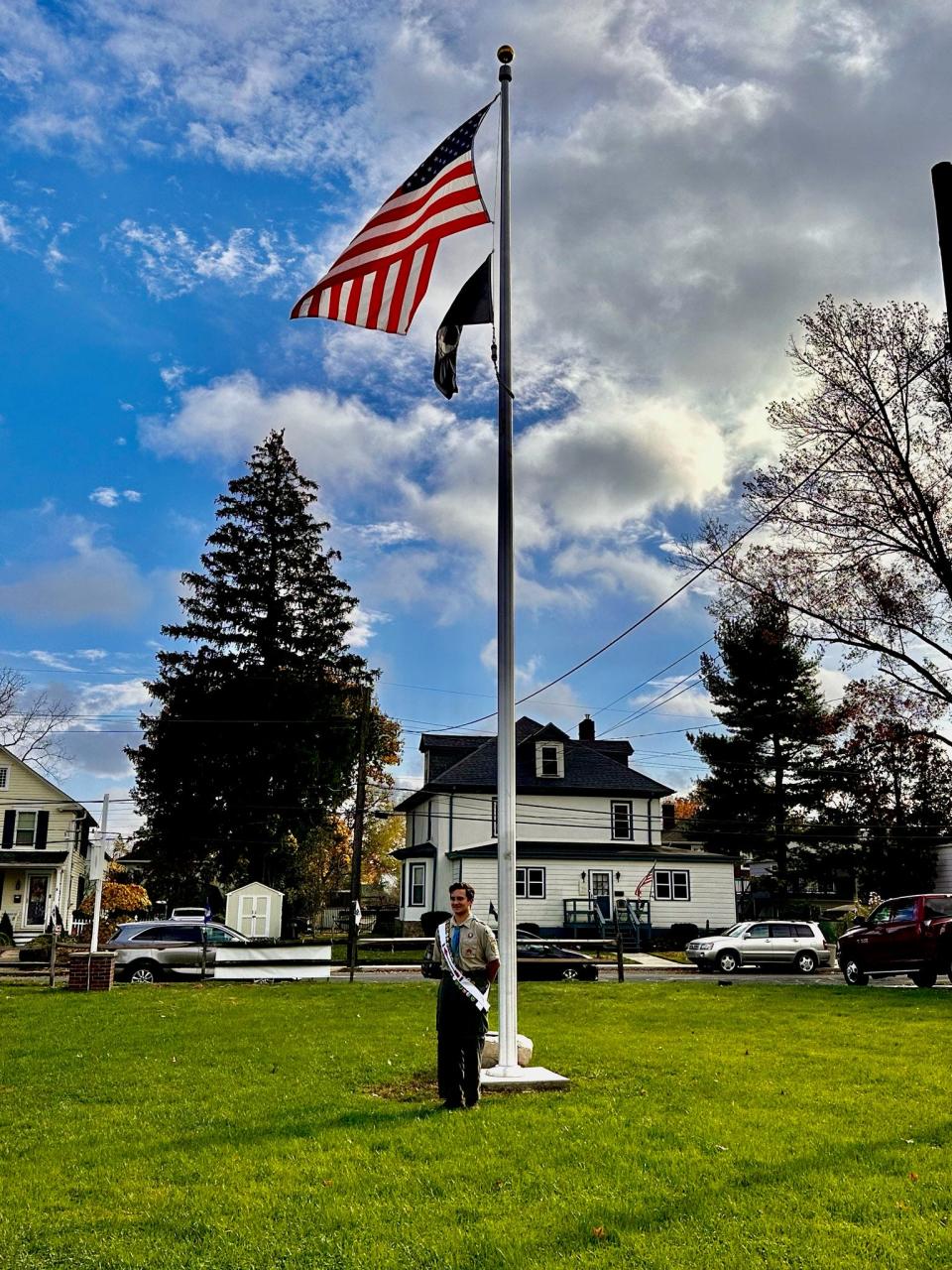 Boy Scout Timothy Bess stands by the flagpole that was installed at the Jesse W. Soby American Legion Post in Langhorne last month after Timothy raised the funds for its purchase and installation as an Eagle Scout project.