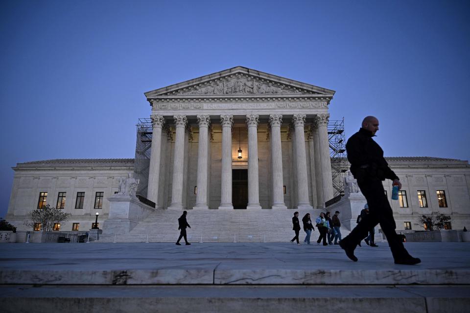 People walk past the Supreme Court in Washington, D.C., on Nov. 13, 2023. / Credit: MANDEL NGAN/AFP via Getty Images