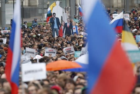 People attend a rally to demand authorities allow opposition candidates to run in a local election in Moscow