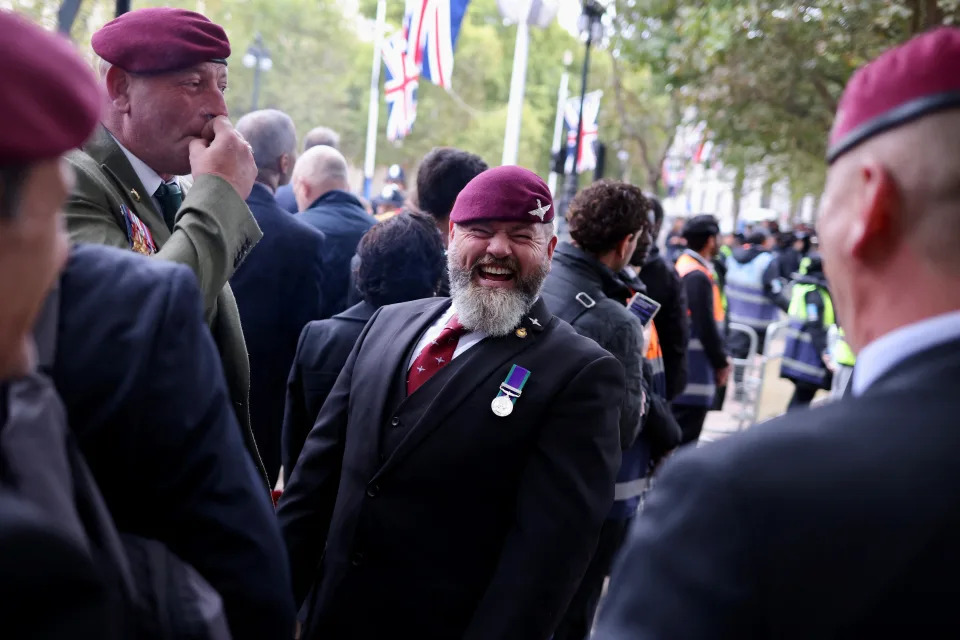 Veterans talk with each other on The Mall on the day of the state funeral and burial of Britain’s Queen Elizabeth in London, Britain September 19, 2022.   REUTERS/Kevin Coombs