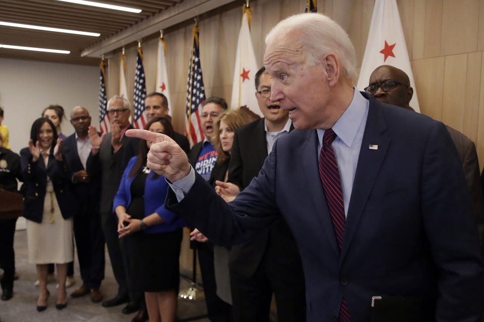 Democratic presidential candidate former Vice President Joe Biden points as reporters ask questions Wednesday, March 4, 2020, in Los Angeles. (AP Photo/Marcio Jose Sanchez)