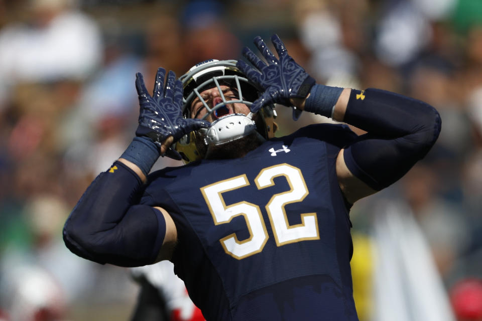 Notre Dame linebacker Bo Bauer (52) celebrates a tackle against New Mexico in the first half of an NCAA college football game in South Bend, Ind., Saturday, Sept. 14, 2019. (AP Photo/Paul Sancya)